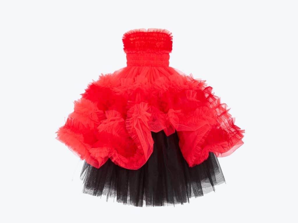 A red and black tulle dress on a white background.